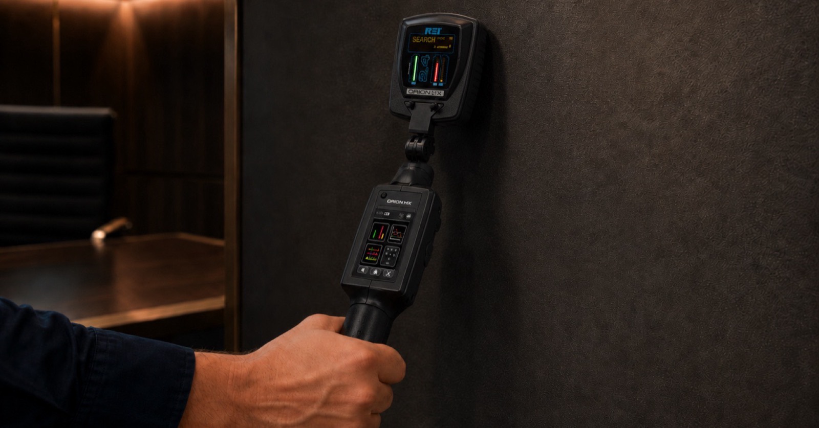 Semiconductor detector against a wall during an electronic security survey in a boardroom